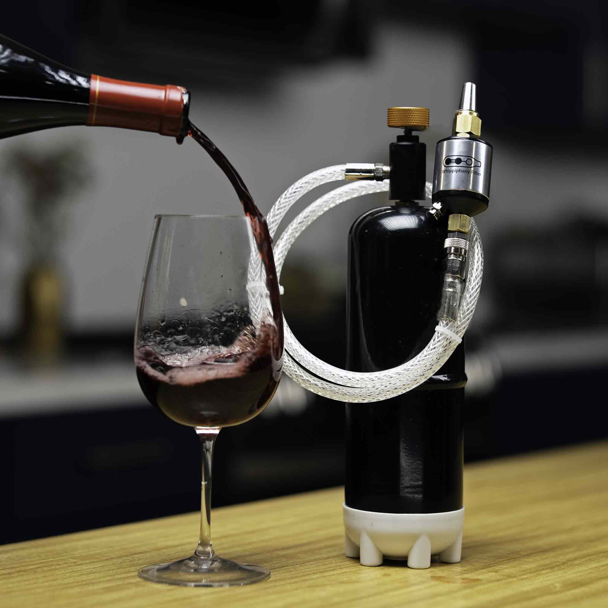 Whippiphany N20 regulator preserving wine freshness, shown next to a wine glass being filled, highlighting N2O regulation features.